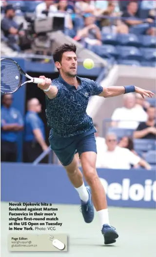  ?? Photo: VCG ?? Novak Djokovic hits a forehand against Marton Fucsovics in their men’s singles first-round match at the US Open on Tuesday in New York.