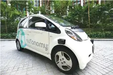  ??  ?? An autonomous vehicle is parked for its test drive in Singapore on Wednesday.