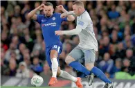  ?? — AP ?? Chelsea’s Danny Drinkwater (left) goes to tackle Everton’s Wayne Rooney during their English League Cup match.