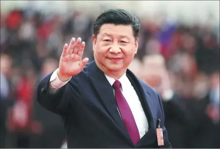  ?? LAN HONGGUANG / XINHUA ?? President Xi Jinping waves at the first session of the 13th National People’s Congress in Beijing.