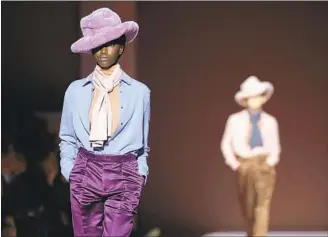  ?? Jonas Gustavsson For the Washington Post ?? TOM FORD’S fall-winter 2019 collection featured silk blouses, satin pants and faux-fur hats.