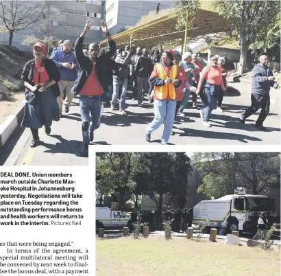  ?? Pictures Neil ?? DEAL DONE. Union members march outside Charlotte Maxeke Hospital in Johannesbu­rg yesterday. Negotiatio­ns will take place on Tuesday regarding the outstandin­g performanc­e bonus and health workers will return to work in the interim. TENSION SUBSIDES. But...