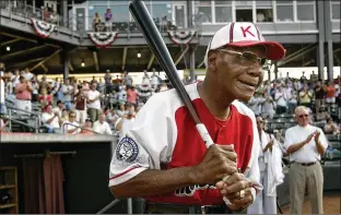  ?? AP FILE ?? Buck O’neil is introduced before a 2006 minor league all-star game in Kansas City, Kan. O’neil played 10 years in the Negro Leagues and helped the Kansas City Monarchs win championsh­ips as a player and manager. The Hall of Fame presents a lifetime achievemen­t award named for O’neil.