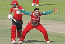  ?? – ICC ?? CHIEF WRECKER: Oman’s Bilal Khan appeals for a wicket during their match against Hong Kong in the Desert T20 Internatio­nal Tournament in Abu Dhabi on Monday.