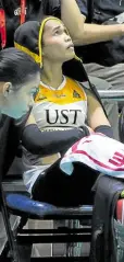  ?? —AUGUST DELA CRUZ ?? Angge Poyos watches helplessly from the bench as Santo Tomas loses to National U in straight sets in Game 1 of the UAAP Finals.