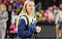  ?? G Fiume/Getty Images ?? Paige Bueckers of the UConn Huskies watches her team warm up before a game against the Maryland Terrapins at Xfinity Center in December 2022 in College Park, Maryland.
