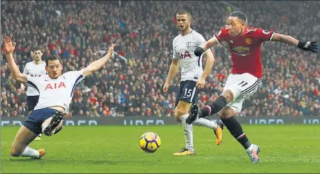  ?? ACTION IMAGES VIA REUTERS ?? Manchester United's Anthony Martial (right) scores in the 81st minute to break the deadlock and steer his side clear on the second spot in the league table.