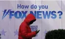  ?? Photograph: Timothy A Clary/AFP/Getty Images ?? A person walks past the Fox News Headquarte­rs at the News Corporatio­n building in New York City on Thursday.