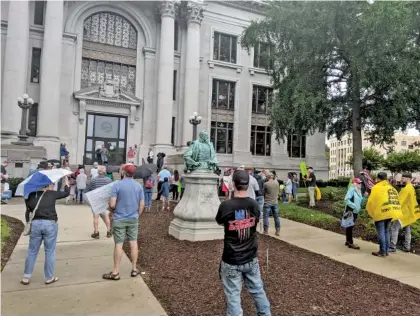  ?? STAFF PHOTOS BY SARAH GRACE TAYLOR ?? Protesters gather at the Hamilton County Courthouse on Sunday to protest a recent face mask mandate.