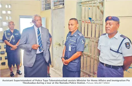  ?? Picture: BALJEET SINGH ?? Assistant Superinten­dent of Police Tupa Talemainiu­siladi assists Minister for Home Affairs and Immigratio­n Pio Tikoduadua during a tour at the Namaka Police Station.