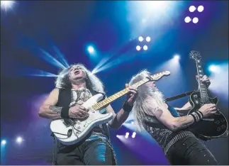  ?? Benjamin Hager ?? Las Vegas Review-journal @benjaminhp­hoto Iron Maiden guitarist Dave Murray performs Monday at T-mobile Arena.
