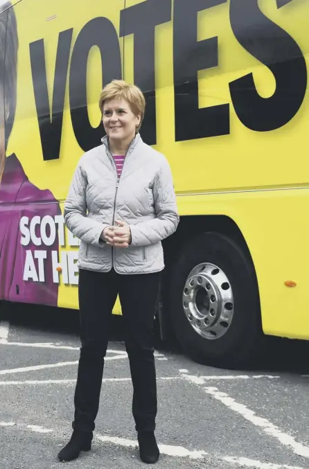  ??  ?? 2 First Minister and leader of the Scottish National Party Nicola Sturgeon poses for a photograph as she campaigns in Glasgow, yesterday. (Photo by Andy Buchanan)