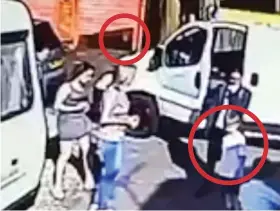  ??  ?? Shocking: CCTV shows the boy being hit by the ball (both circled), sending him flying