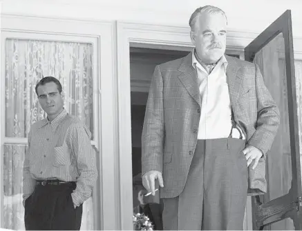  ?? THE WEINSTEIN COMPANY ?? Joaquin Phoenix, left, and Philip Seymour Hoffman in a scene from The Master, which showcased yet another fine performanc­e from Hoffman.