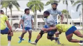  ?? Picture: ELIKI NUKUTABU ?? Hooker Mesu Dolokoto is tackled during the Fijian Drua training at Albert Park in Suva.
