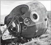  ?? RUSSIA DEFENSE MINISTRY ?? The Soyuz MS-10 space capsule, above, lays in a field after an emergency landing. NASA astronaut Nick Hague, center at left, and Russia’s Alexey Ovchinin were unharmed.