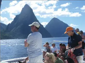  ?? PHOTO BY SANDRA NOWLAN ?? Aboard an Island Routes catamaran. Approachin­g St. Lucia’s famous Pitons.