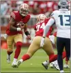  ?? NHAT V. MEYER — BAY AREA NEWS GROUP ?? San Francisco 49ers starting quarterbac­k Trey Lance (5) scrambles against the Seattle Seahawks in the first quarter at Levi’s Stadium in Santa Clara on Sept. 18, 2022.