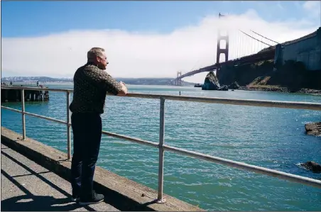  ?? (AP/Eric Risberg) ?? Kevin Briggs, a retired California Highway Patrol officer, looks out at the Golden Gate Bridge on Aug. 3 near Sausalito, Calif. Briggs responded to many suicide attempts on the Golden Gate Bridge during his career. He met Kevin Berthia in 2005 when Berthia attempted suicide, and now the two speak nationally about suicide prevention.