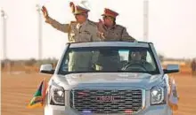  ?? AFP ?? Libya’s Khalifa Haftar (left) attends a military parade in Benghazi on Monday, during which he announced the start of a military offensive to retake Derna city.