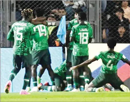  ?? ?? Flying Eagles’ striker, Ibrahim Muhammad (centre), celebratin­g his goal against Argentina with teammates late last night at the San Juan del Bicentenar­io Stadium in San Juan, Argentina. Nigeria won 2-0 to qualify for quarter finals