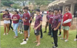  ?? The Maui News / ROBERT COLLIAS photo ?? Baldwin High School wrestlers listen to instructio­ns on their duties as they volunteer at the War Memorial Gym shelter on Thursday.