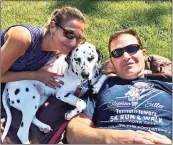  ?? Contribute­d photo ?? Fairfield County Trauma Response Team Board Member Dawn Roy, LCSW, and her husband, Jacques Roy of Stamford Fire and Rescue, with their dog, Lucky.