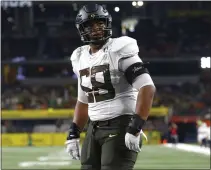  ?? ASSOCIATED PRESS FILE PHOTO ?? Oregon offensive lineman Penei Sewell (58) looks on as Oregon plays Auburn in a 2019 game in Arlington, Texas.