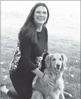  ?? ?? Picture of Annie Anderson, the Synergy Centre’s Reiki Master and EFT practition­er, as well as her dog.