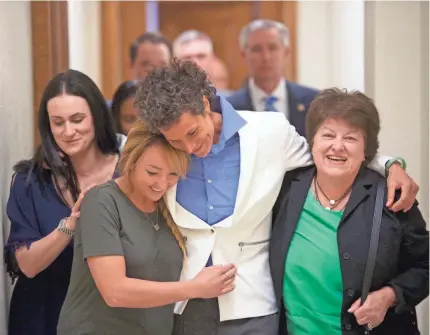  ?? MARK MAKELA/GETTY IMAGES ?? Bill Cosby accuser Andrea Constand, center, leaves court after the guilty verdicts Thursday.