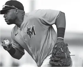  ?? SAM NAVARRO/USA TODAY SPORTS ?? Marlins first baseman Jesus Aguilar fields the ball against the Mets during a spring training game Sunday in Jupiter, Fla.