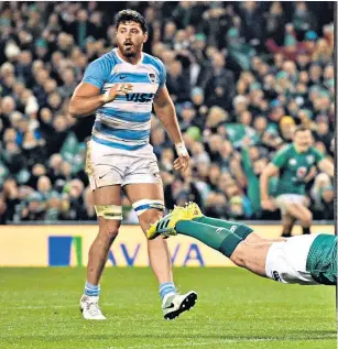  ??  ?? Scoring in style: Luke Mcgrath dives over the line for Ireland’s third try