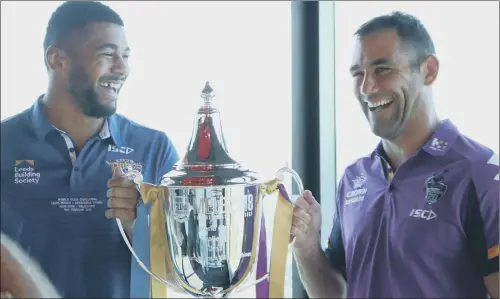  ?? PICTURE: LEEDS RHINOS ?? IN CHARGE: Leeds Rhinos captain Kallum Watkins, left, and Melbourne Storm counterpar­t Cameron Smith with the World Club Challenge trophy.