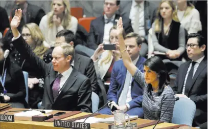  ?? Mark Lennihan ?? The Associated Press Matthew Rycroft, left, Britain’s ambassador to the U.N., and U.S. Ambassador Nikki Haley vote Friday in favor of a resolution that imposes tough new sanctions against North Korea.