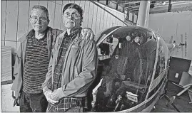  ?? [TOM DODGE/DISPATCH] ?? Lowell Newsome, right, with his son, Chris, is looking for a pilot to take him up in his Robinson R22 helicopter. A stroke grounded the elder Newsome, meaning the two-seater copter has been sitting in his garage.