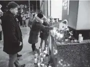  ?? WOJTEK STROZYK AP ?? People mourn Mayor Pawel Adamowicz in Gdansk, Poland, on Monday. Adamowicz was stabbed on stage during a charity event on Sunday.