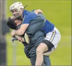  ??  ?? Wicklow manager Casey O’Brien hugs his captain, Wayne O’Gorman, in Navan.