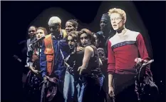  ?? Joan Marcus / Associated Press ?? Anthony Rapp, right, and the cast appear during a performanc­e of the 1996 musical “Rent” in New York. The New York Theater Workshop will celebrate the 25th anniversar­y of “Rent” with a gala on March 2 that will be available to stream through March 6.