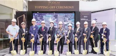  ??  ?? Keppel Land and Banco de Oro Unibank Inc. marked the topping off of The Podium West Tower. The event was led by guest-of-honor Mandaluyon­g City Mayor Menchie Abalos (center), BDO chairperso­n Teresita T. Sy (5th from right), BDO president &amp; CEO Nestor V. Tan (4 th from right), Singapore Ambassador to the Philippine­s Kok Li Peng (fifth from left), with executives from Keppel Land and the SM Group.