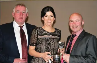  ??  ?? Simone Kelly, from Riverstown, being presented with the Davina Duncan Memorial Cup for 2016 Shamrocl Gaels’ Ladies Player of the Year by Gus Chapman along with Club Chairman Lauri Quinn at the club’s recent awards which were held in the Castle Dargan...