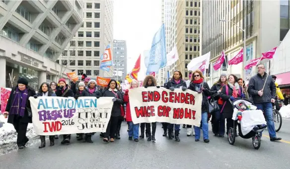 ??  ?? Demonstrat­ors participat­e in the Internatio­nal Women’s Day March in Toronto, March 5, 2016.