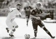  ?? Mark Mulligan / Staff photograph­er ?? Memo Rodriguez, right, and the Dynamo played two games before the coronaviru­s pandemic interrupte­d the season.