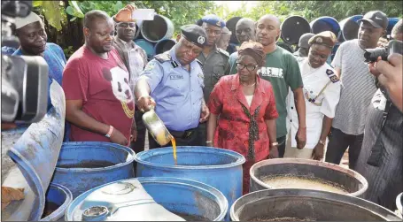  ??  ?? Lagos State Commission­er of Police, Imohimi Oluwole Edgal, examining the illegal brewery at Ikorodu..in Lagos...yesterday