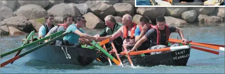  ??  ?? The second place crew of Jackie Goodwin, Joe Rua, Mairtín and Michael Mulkerins in the senior men’s race at the Maharees Regatta congratula­te the winning crew of John Joe and Patrick Hussey, Sean Scanlon and Colm O’Connor.