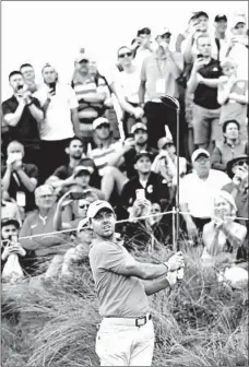  ?? PETER MORRISON/AP ?? Northern Ireland’s Rory McIlroy has a healthy gallery watching his tee shot on the seventh hole of his practice round at Royal Portrush on Tuesday.