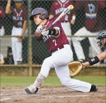  ?? The Maui News / MATTHEW THAYER photo ?? Baldwin’s Isaiah Souza follows through on a third-inning single during a preseason game against Iolani on Feb. 28, 2019.