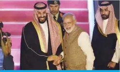  ??  ?? NEW DELHI: Saudi Crown Prince Mohammed bin Salman shakes hands with Indian Prime Minister Narendra Modi upon arriving at the airport yesterday. — AFP