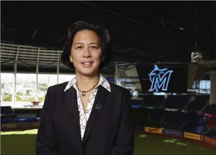  ?? JOSEPH GUZY/ MIAMI MARLINS ?? In this photo provided by the Miami Marlins, new Miami Marlins general manager Kim Ng poses for a photo at Marlins Park stadium before being introduced during a virtual news conference, Monday, Nov. 16, 2020, in Miami. Ng discussed her climb to become the first female GM in the four major North American profession­al sports leagues.
