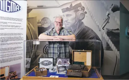  ?? RILEY BRANDT / U OF C ?? Prof. John Ferris, pictured beside an Enigma display, is writing the official 100-year history of Britain’s GCHQ intelligen­ce agency.