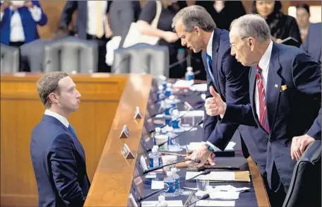  ?? Brendan Smialowski AFP/Getty Images ?? FACEBOOK’S Mark Zuckerberg, from left, was questioned by Sens. John Thune (R-S.D.), Charles E. Grassley (R-Iowa) and others.